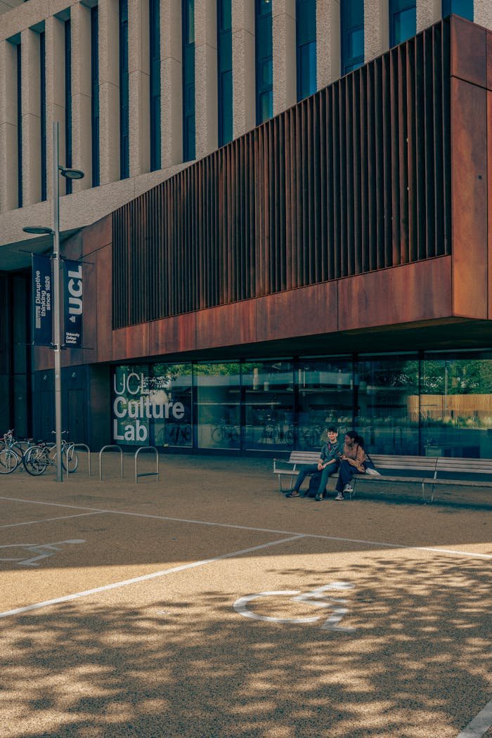 Modern architecture of UCL Culture Lab, London with pedestrians in view.